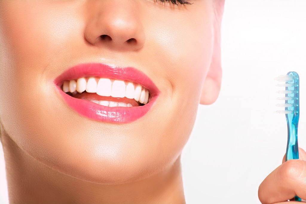 Happy Brisbane woman with whiter teeth after zoom teeth whitening treatment in Sandgate North Brisbane