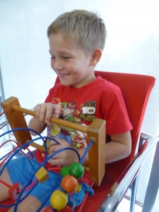 Boy playing with practice toys