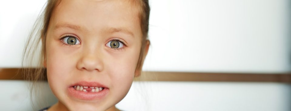 adult teeth coming in behind baby teeth